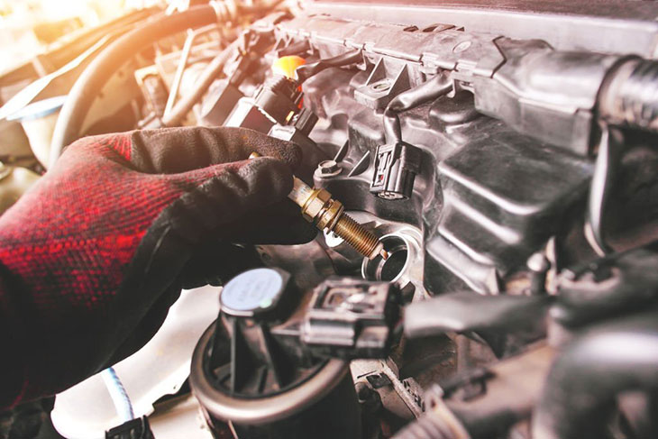 spark plug won't screw in